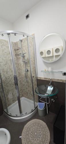 a bathroom with a shower and a sink at prestige house 5 in Scalea