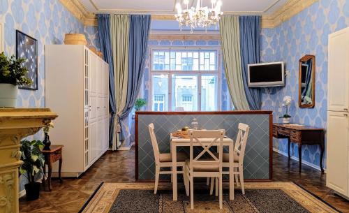 a dining room with a table and chairs at Atlashouse in Rīga