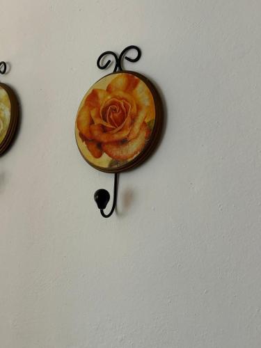 a painting of a rose on a wall at Villa del Monte di Cocco in Massarosa