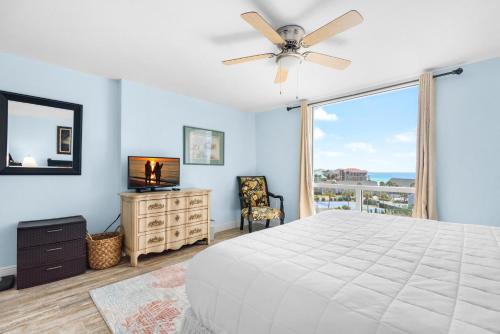a bedroom with a bed and a window with a view at Shoreline Towers 3063 in Destin