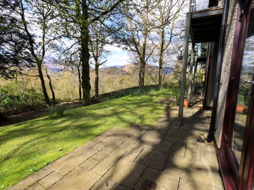 a porch with a view of a field of grass at Puddleduck in Ambleside
