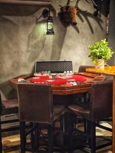 a table with a laptop on top of it at The Pub - Unique & Authentic Experience - Free Parking!, 5 minutes from Airbus and The Mall Cribbs in Bristol
