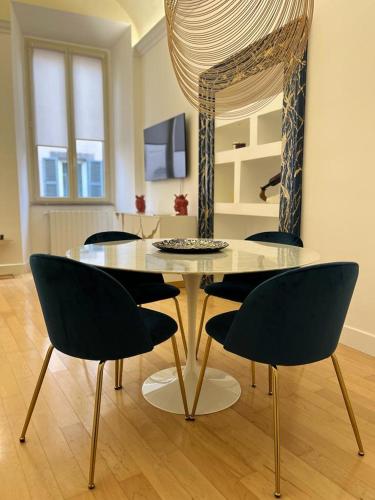 a dining room with a glass table and chairs at Casa Cavour Viterbo in Viterbo