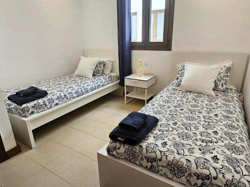 Postel nebo postele na pokoji v ubytování Duplex Noray vista a la piscina