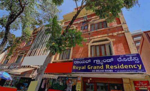a building with a sign for a royal grand residency at Hotel O Royal Grand Residency Near Lalbagh Botanical Garden in Bengaluru