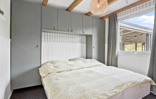 a bedroom with a bed and a large window at 2 Bedroom Beautiful Home In Hurup Thy in Sindrup