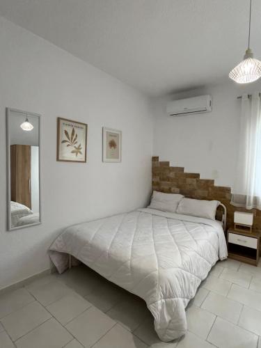 Ένα ή περισσότερα κρεβάτια σε δωμάτιο στο Sweet Home Hanioti