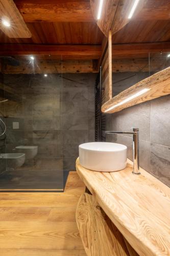 a bathroom with a sink and a shower at Elva Apartments in Elva