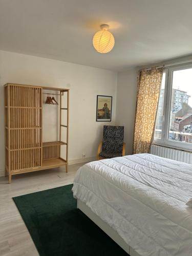Кровать или кровати в номере La Mer à Pied appartement vue mer