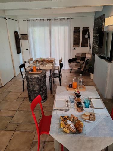 a living room with a table with food on it at B&B Flavio e Catia in Marotta