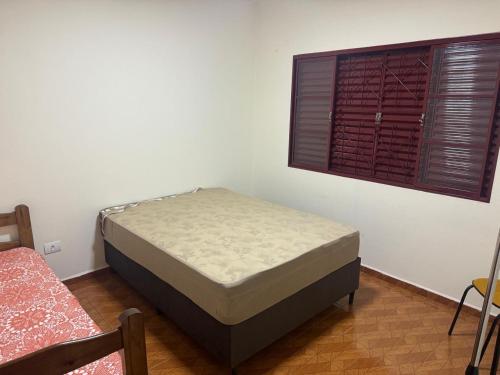 Un ou plusieurs lits dans un hébergement de l'établissement Casa Cachoeira de Emas