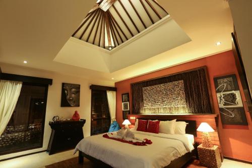 Una cama o camas en una habitación de Ubud Virgin Villa