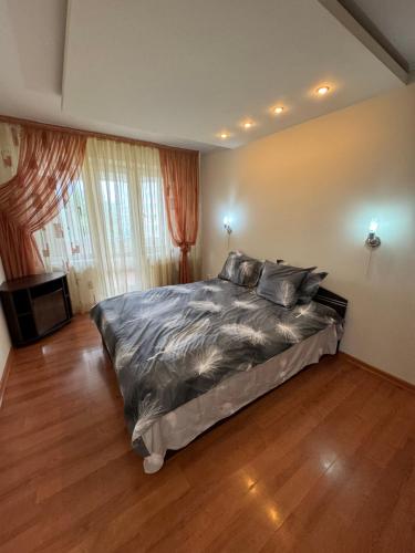 En eller flere senge i et værelse på Sun Apartment