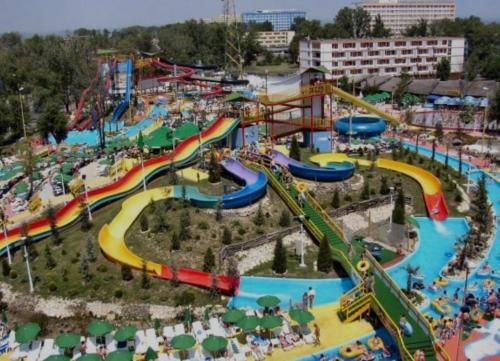 an amusement park with a water park with slides at Style apartment in Mamaia Nord
