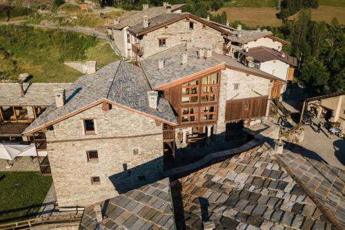 an aerial view of a large stone house at Elva Apartments in Elva
