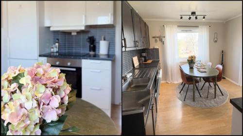 レクネスにあるHouse with perfect location in Leknesのキッチン(カウンター、花瓶付きテーブル付)