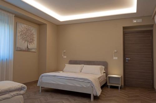 Un pat sau paturi într-o cameră la Tenute Masullo
