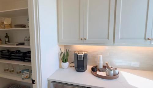 a kitchen counter with a coffee maker on it at Pitso aparhotel in Johannesburg
