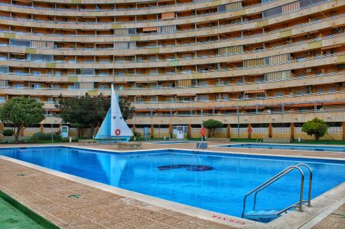 Kolam renang di atau dekat dengan Calpe apartamento a estrenar 1a línea playa y piscina