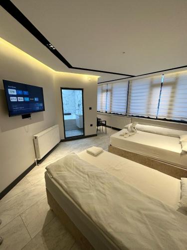 Katil atau katil-katil dalam bilik di Antik Otel