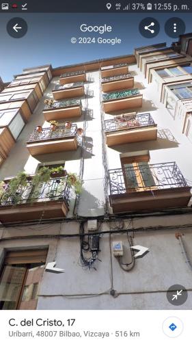 a building with balconies on the side of it at A 5 minutos andando del Casco Viejo, ayuntamiento, Plaza Circular y Gran Vía de Bilbao y próximo a las 2 líneas de metro in Bilbao