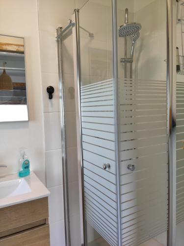 a bathroom with a shower and a sink at Where winery meets olive trees 