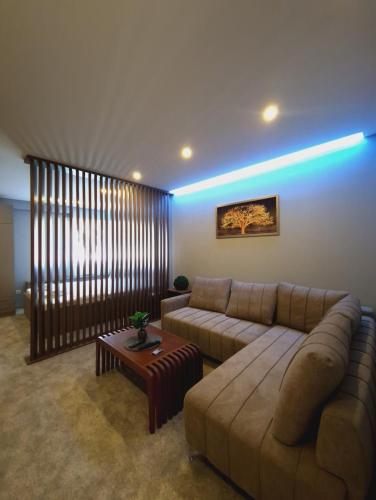 a living room with a couch and a table at Apartmani Maksa in Stanovo