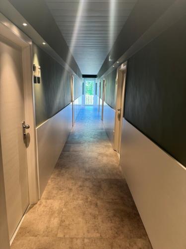 a long hallway with a long corridor at Hotel Everest - Bar e Ristorante in Gabicce Mare