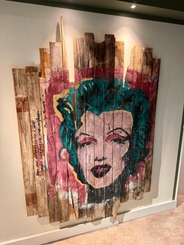 a painting of a woman on a wall at Hotel Everest - Bar e Ristorante in Gabicce Mare