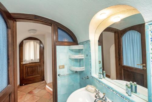 a bathroom with a sink and a mirror at Charming Villa, with terrace overlooking the sea, Amalfi coast, 170 steps from the road in Conca dei Marini