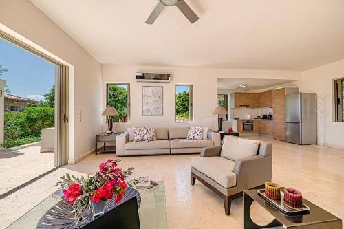 a living room with a couch and a table at Costa Bianca Villas in Koilás