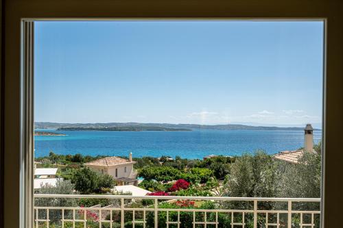 a view of the ocean from a window at Costa Bianca Villas in Koilás