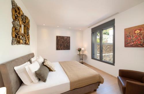 Кровать или кровати в номере Villa Sendal Spinalonga View