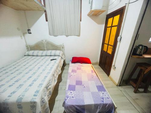 Una cama o camas en una habitación de Rinconcito en Pompeya