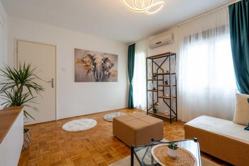 En eller flere senge i et værelse på Apartment UR