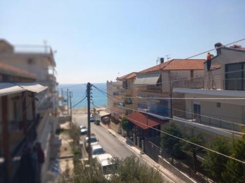 a view of a city street with buildings at Thalia`s Apartment near the beach in Nea Kalikratia