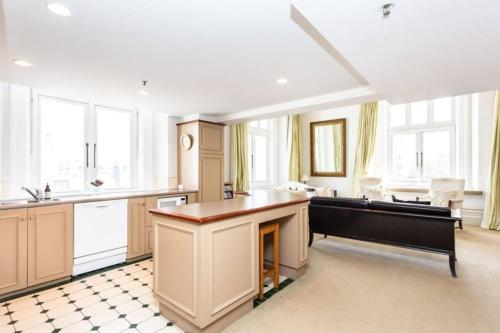 a large kitchen with a pool table in it at McMahon Suite - Central CBD in Christchurch