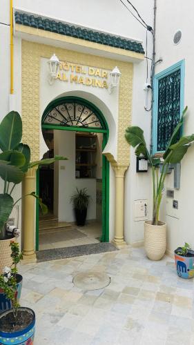 an entrance to a building with a sign that reads united barcal machine at Hotel Dar Al Madina in Mahdia