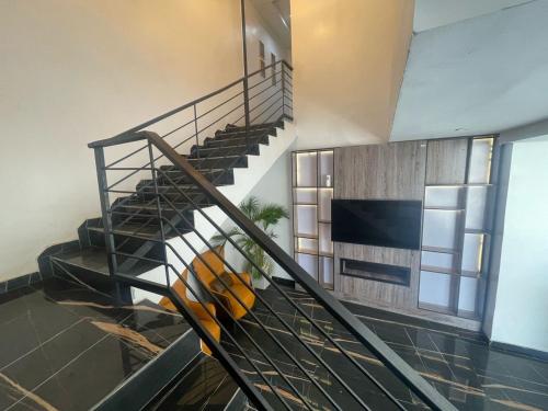 a staircase in a building with escalators at Ujuuu apartments in Lekki