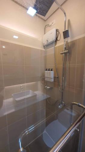 a bathroom with a sink and a shower in it at Luxury Condo with a view of Manila Bay in Manila