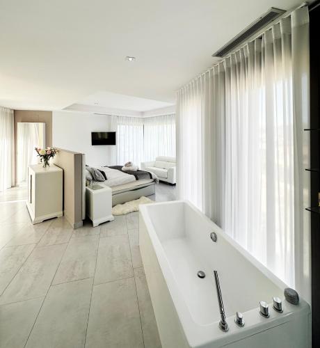 Ένα ή περισσότερα κρεβάτια σε δωμάτιο στο Exquisite Luxury Paradise