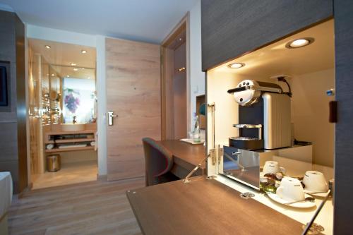 a hair salon with a hair dryer on a table at Hotel-Restaurant Schwanen in Metzingen