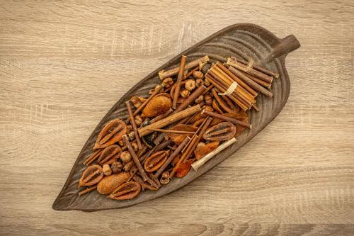 a wooden plate filled with different types of sticks at Apartment @Katehaki Metro in Athens