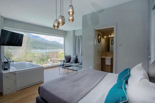a bedroom with a bed and a tub and a television at Boat Villa in Yenion