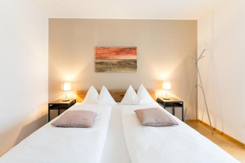 Un pat sau paturi într-o cameră la Apartment Oberlechner