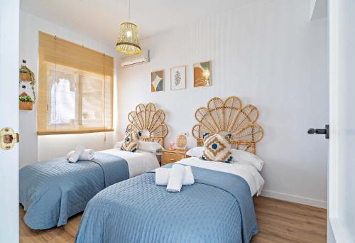 En eller flere senge i et værelse på APARTAMENTO BELLAVISTA beach