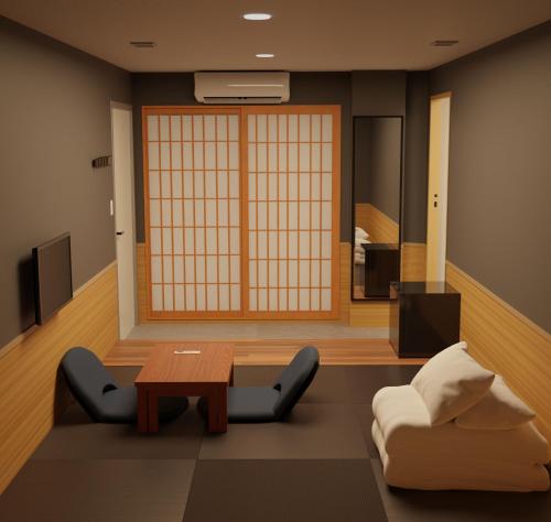 a living room with a couch and a table at My Home Inn Sennan, Onosato in Ozaki