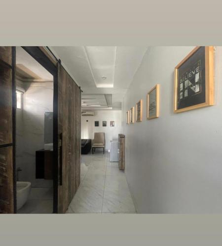 a hallway with a hallway leading to a room at Ujuu apartment in Lekki