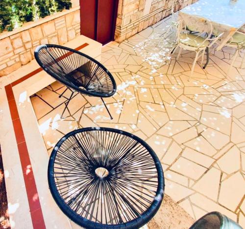 a table and two chairs on a patio at Dalmatian House, spacious stone terraces, balcony , views in Dubrovnik