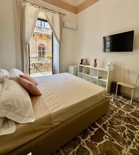 Ένα ή περισσότερα κρεβάτια σε δωμάτιο στο Casa MiRè
